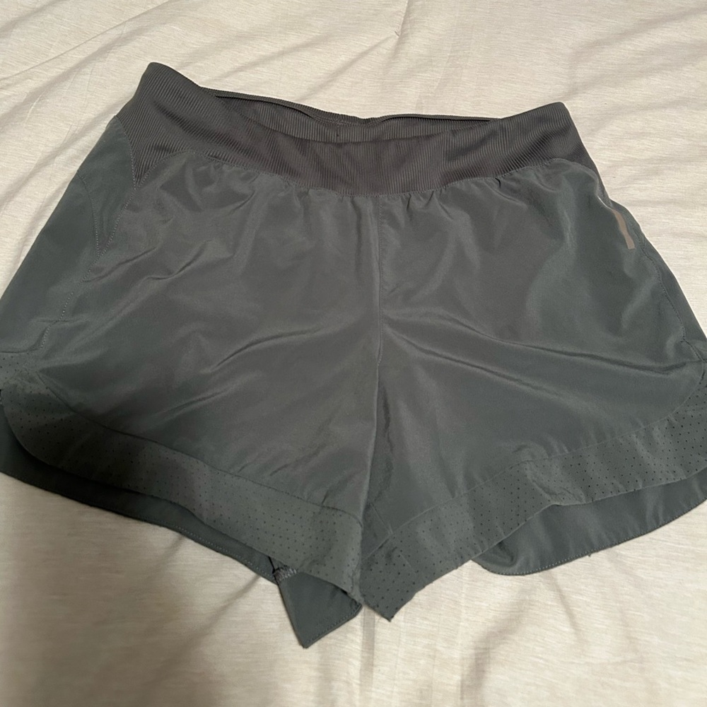 Green REI running shorts